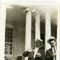 Two Unidentified Men Drinking